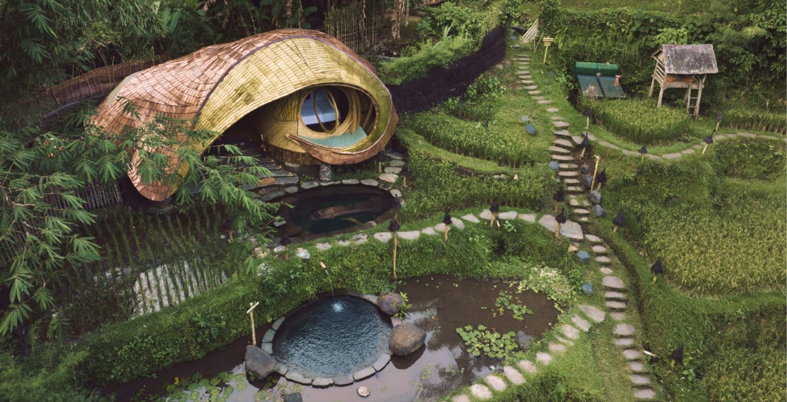 The New Moon House, a woven bamboo cocoon opening over the natural pools and rice terraces